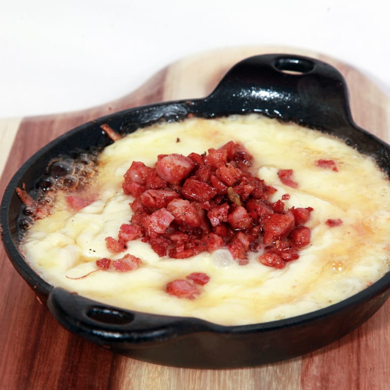 Indulge in Our Irresistible Queso Fundido